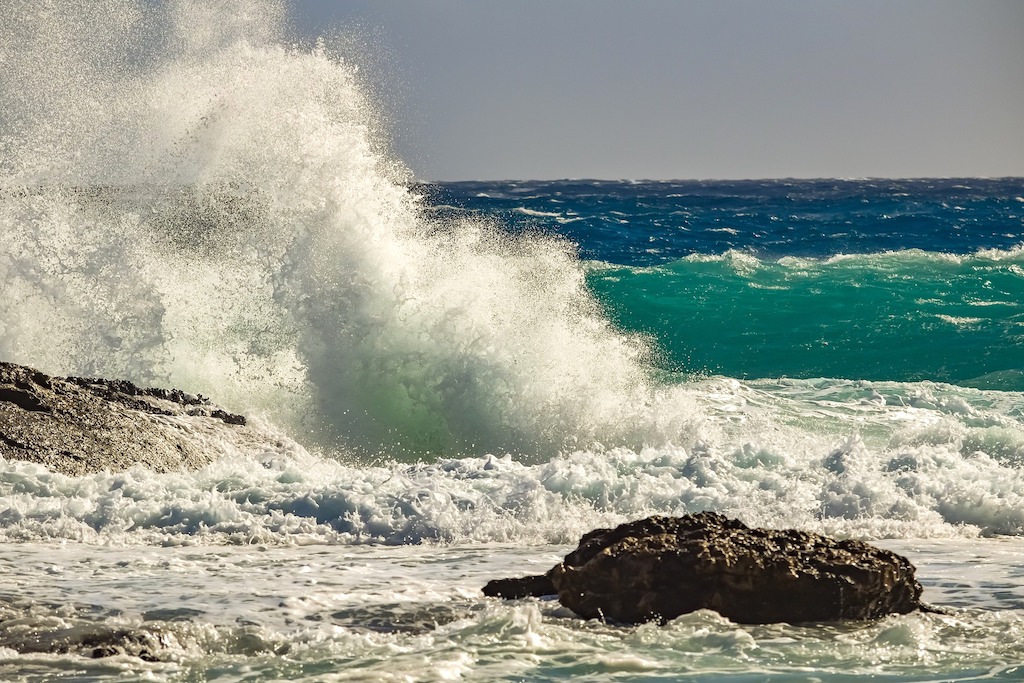Crashing Waves Against Rocks